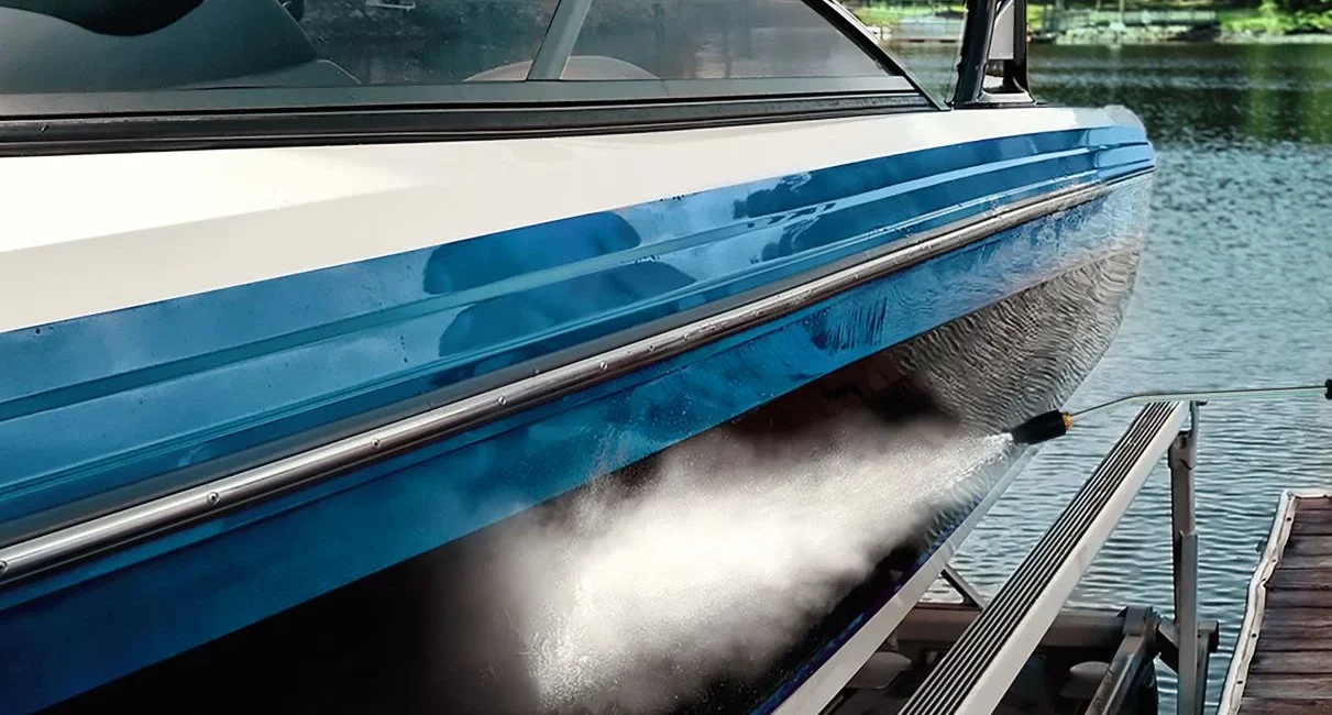 Pressure washer stream on the side of a boat